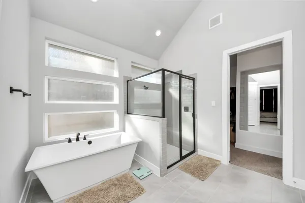 a bathroom with a bathtub and a sink