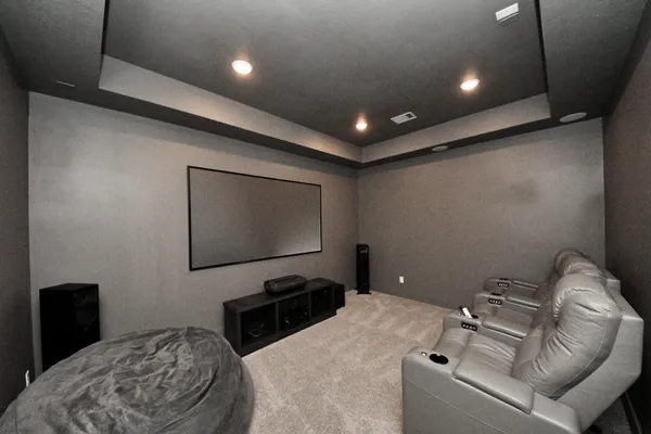 a bedroom with a bed and a television