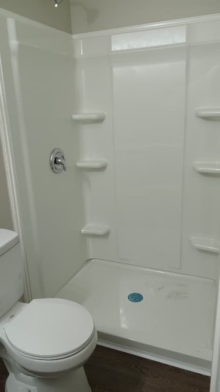 611 Carpenter Avenue, Unit 201 Austin, TX 78753 - Photo 11 of 17 a bathroom with a toilet and a shower