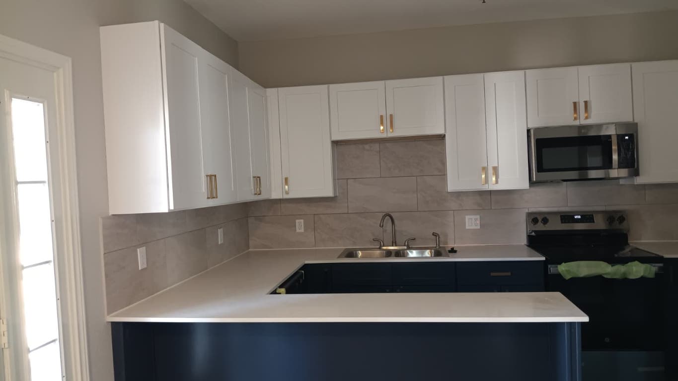 611 Carpenter Avenue, Unit 201 Austin, TX 78753 - Photo 2 of 17 a kitchen with a sink and cabinets