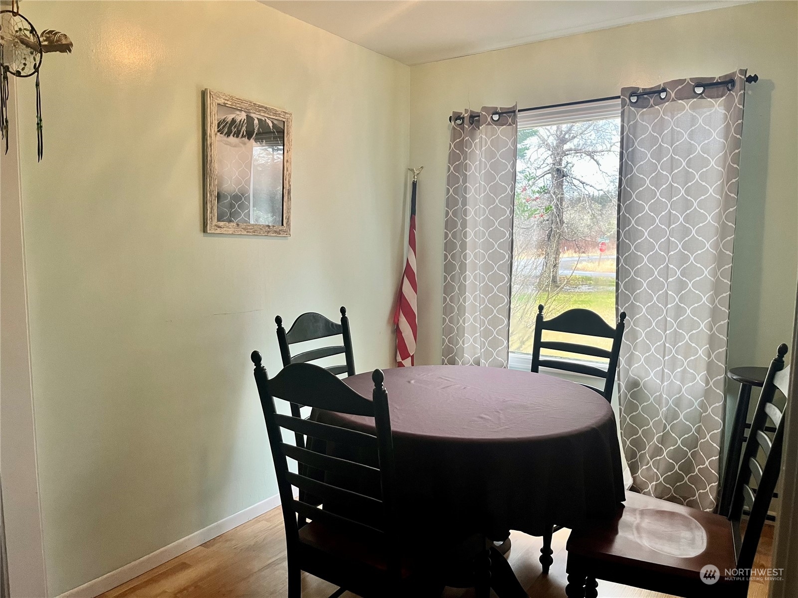 2998 Alexson Road Grayland, WA 98547 - Photo 11 of 27 a view of a dining room with furniture and a window
