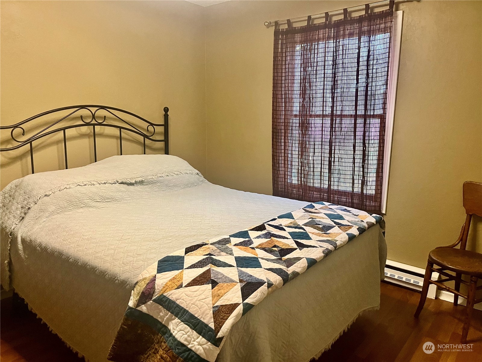 2998 Alexson Road Grayland, WA 98547 - Photo 14 of 27 a bedroom with a bed and chair