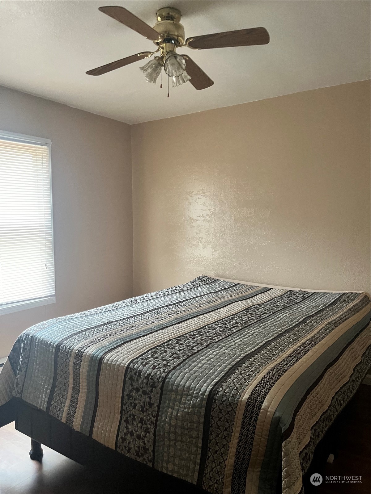 2998 Alexson Road Grayland, WA 98547 - Photo 18 of 27 a bedroom with a bed and a chandelier