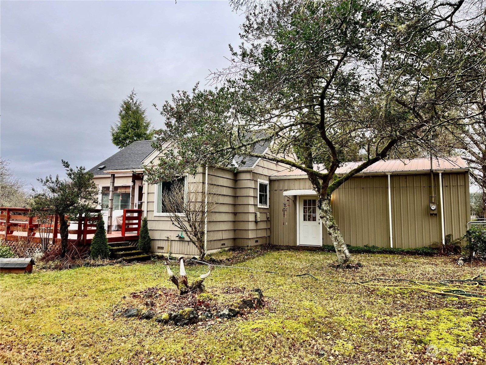 2998 Alexson Road Grayland, WA 98547 - Photo 19 of 27 a house with trees in front of it