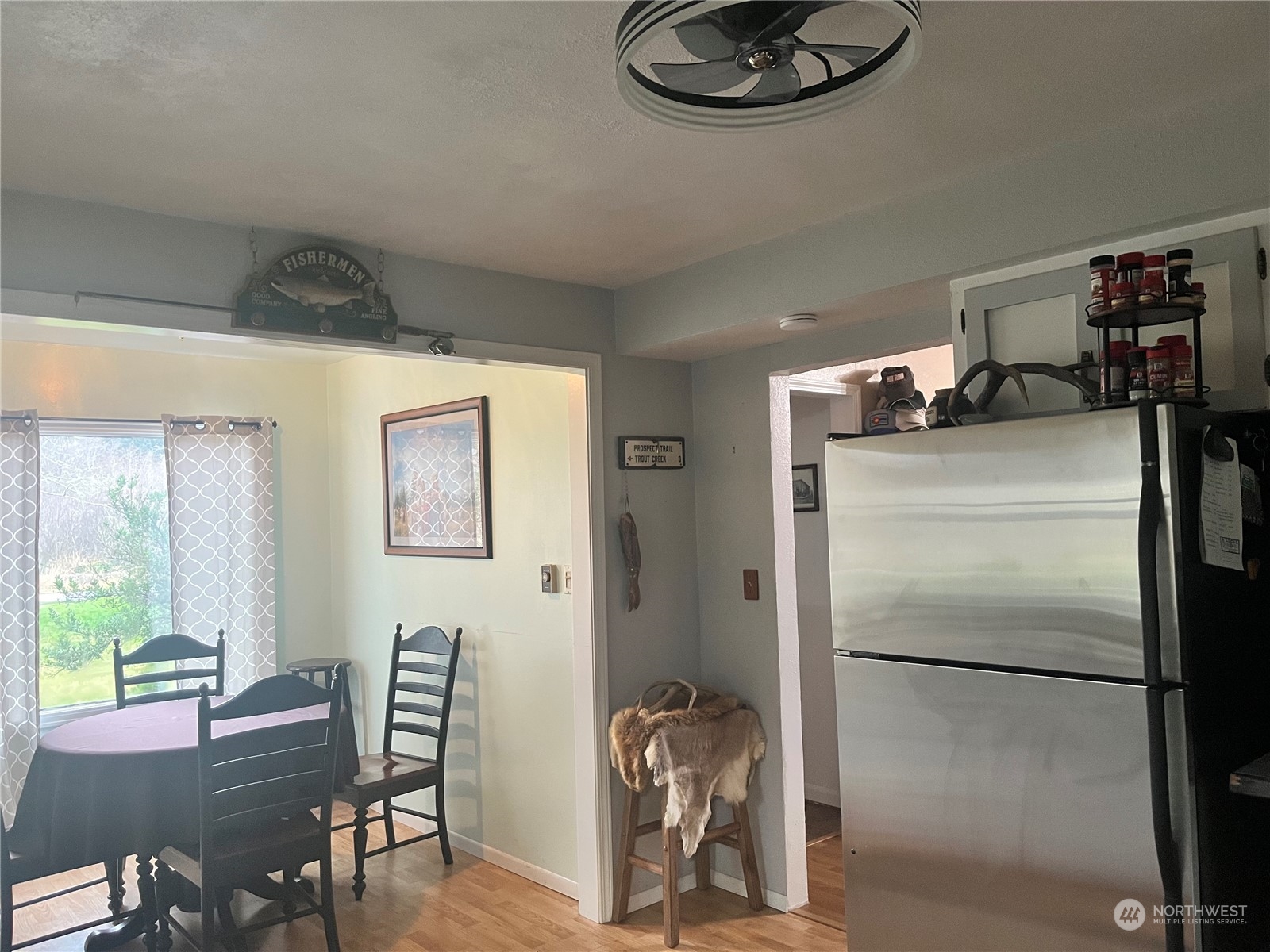 2998 Alexson Road Grayland, WA 98547 - Photo 6 of 27 a room with a refrigerator and a table
