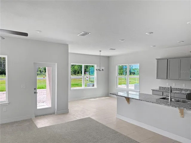 a view of a kitchen with a sink and a window