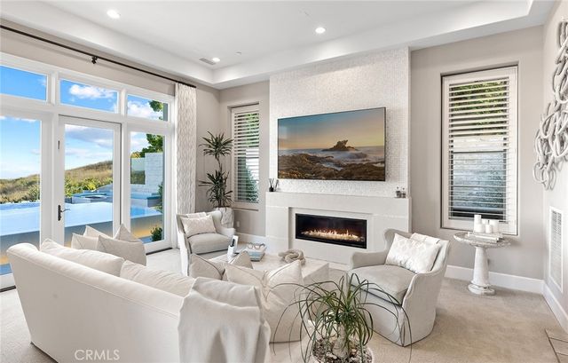 a view of a terrace with couches and sky view