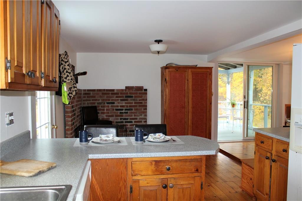 128 Spring Street Brownfield, ME 04010 - Photo 5 of 33 View from kitchen towards wood stove...