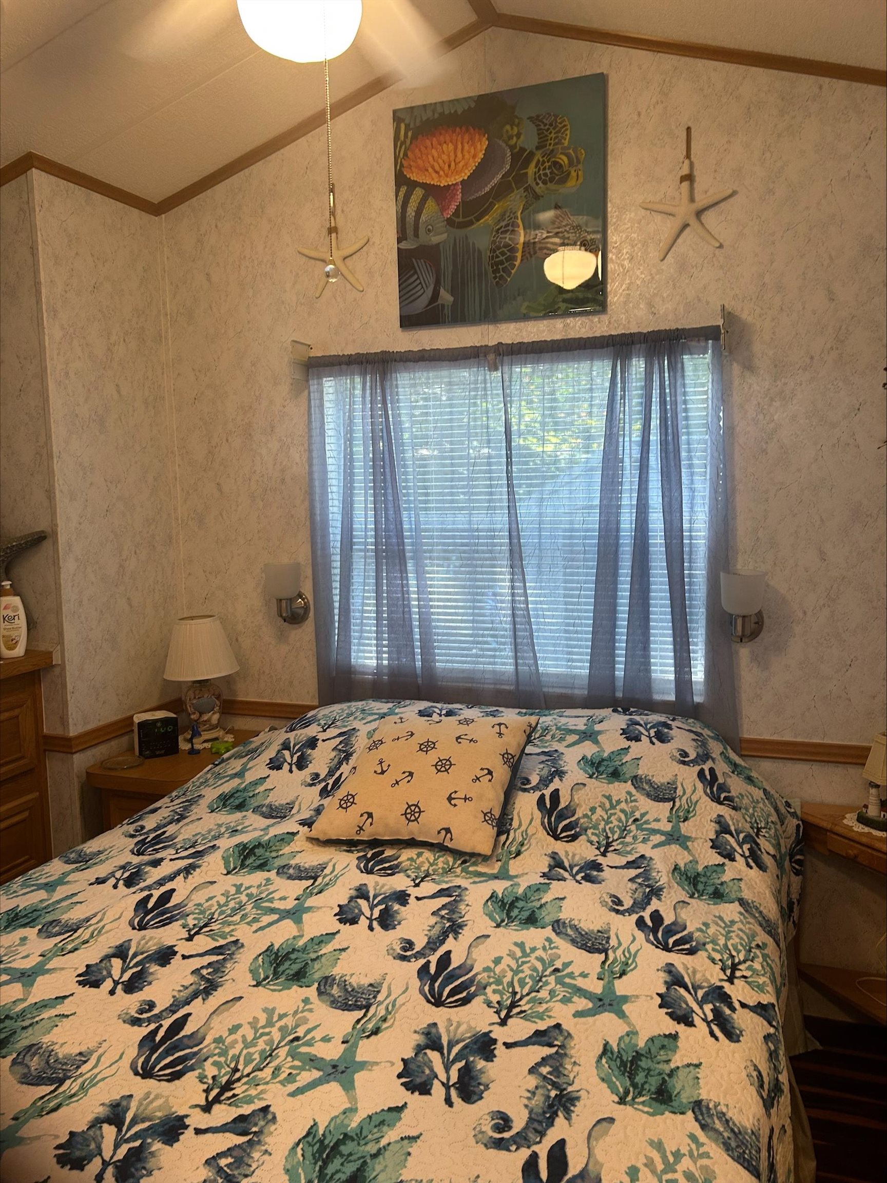 709 Us Rt 9 S, Unit 623 Cape May, NJ 08204 - Photo 8 of 10 a bedroom with a bed and curtain