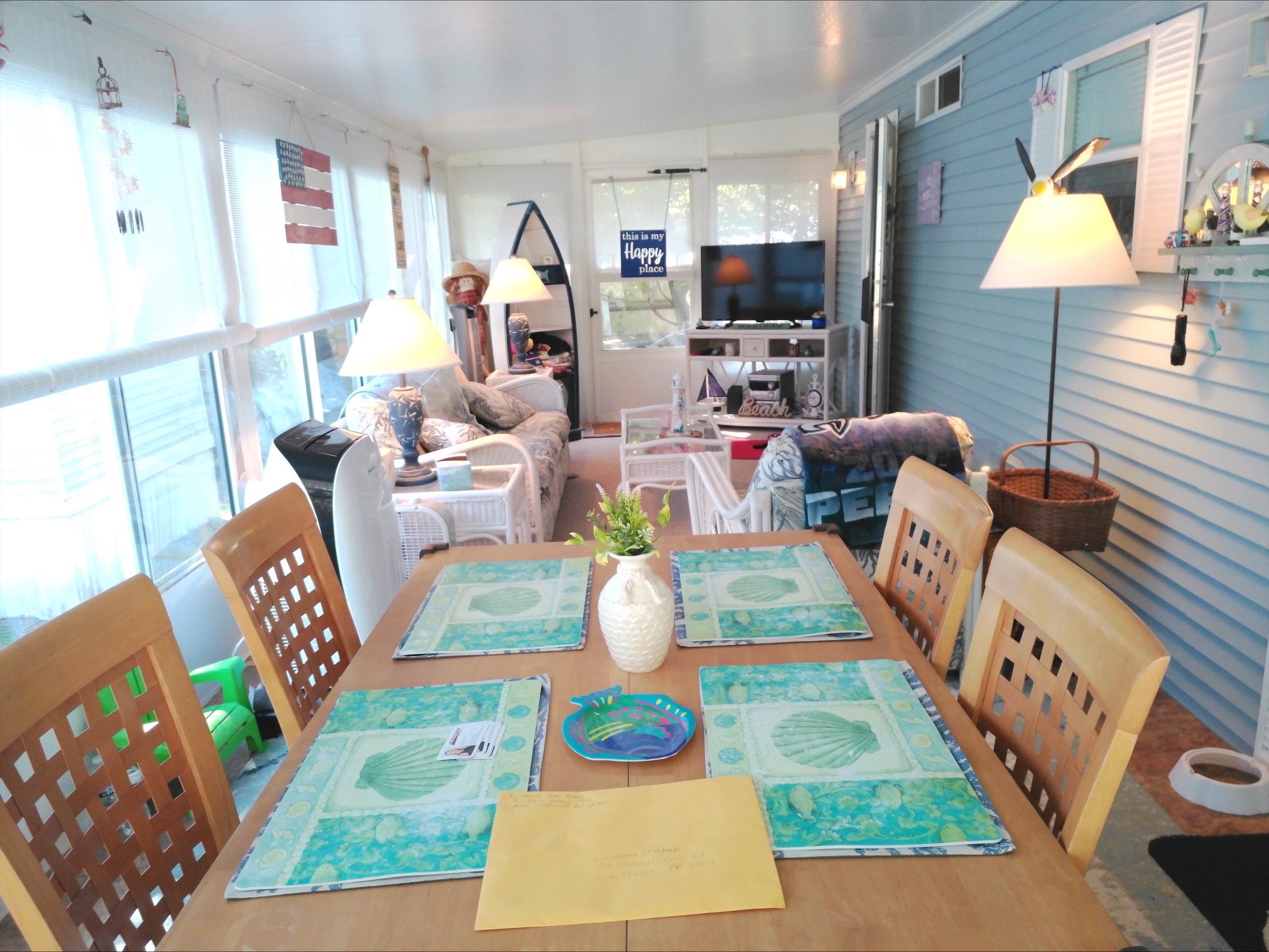 709 Us Rt 9 S, Unit 623 Cape May, NJ 08204 - Photo 9 of 10 a living room with furniture and a lamp