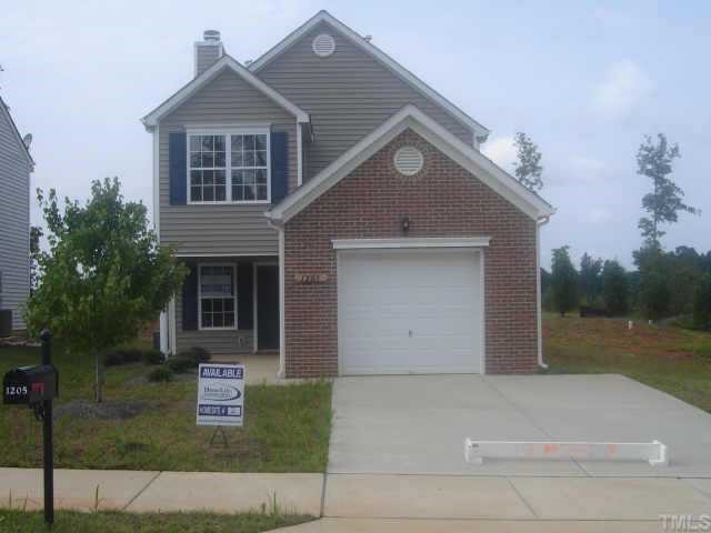 1205 Ricochet Drive Raleigh, NC 27610 - Photo 1 of 1 a front view of a house with a yard