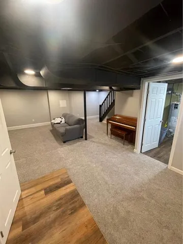an empty room with staircase