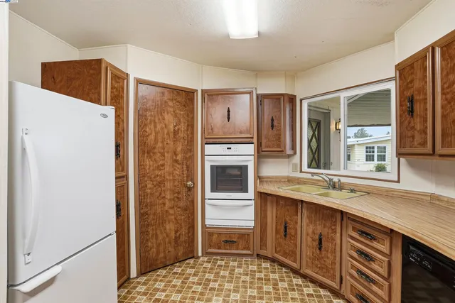 a kitchen with a stove and a sink