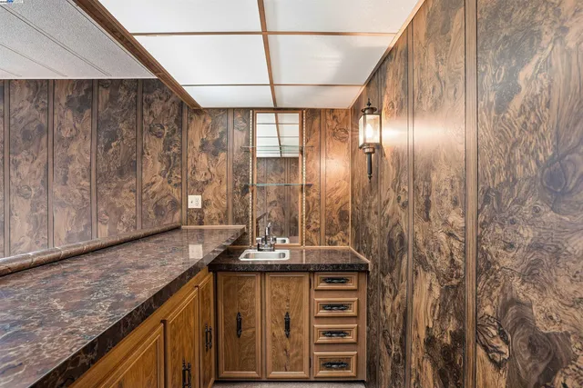 an empty room with entrance and windows