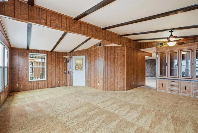 a view of a room with cabinet and windows