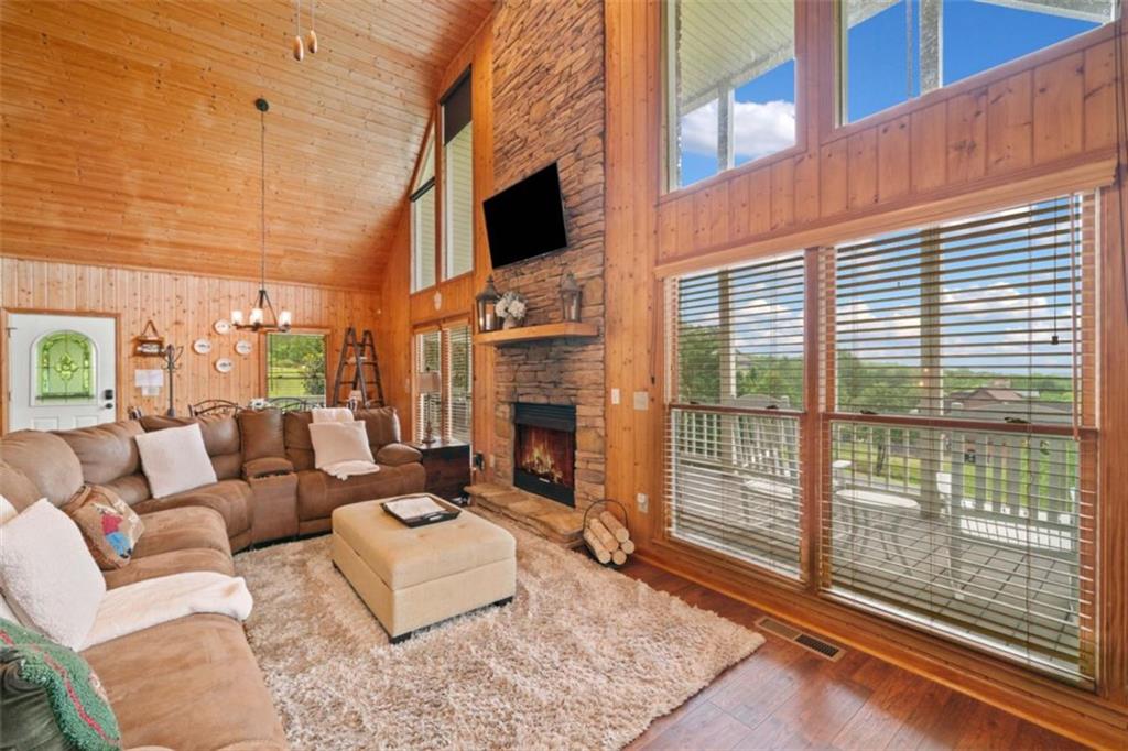 82 Emelia Road Morganton, GA 30560 - Photo 14 of 45 a living room with furniture a flat screen tv and a fireplace