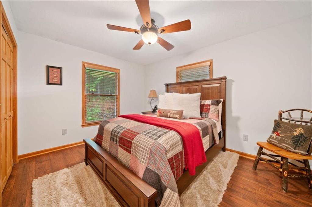 82 Emelia Road Morganton, GA 30560 - Photo 21 of 45 a bedroom with a bed and wooden floor
