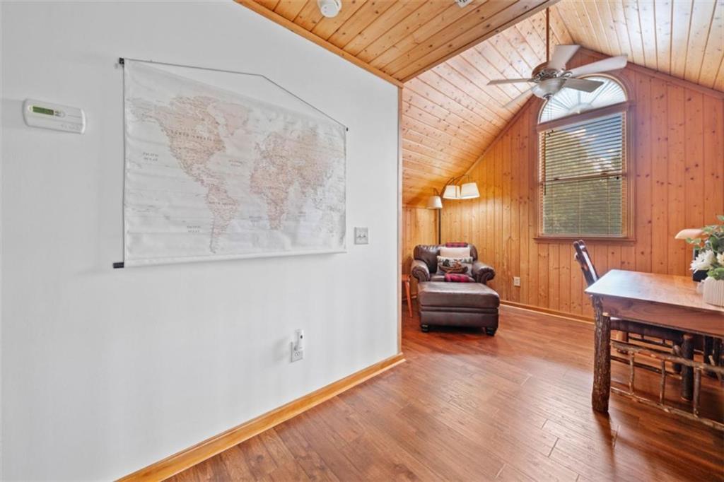 82 Emelia Road Morganton, GA 30560 - Photo 23 of 45 a bedroom with furniture and a chandelier