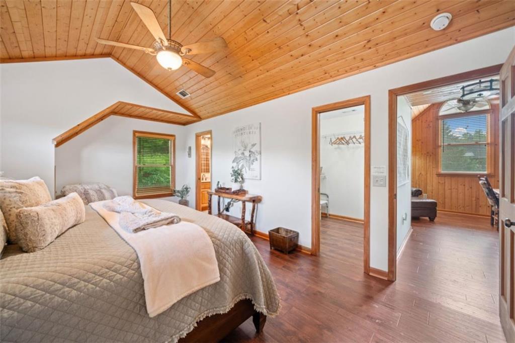 82 Emelia Road Morganton, GA 30560 - Photo 25 of 45 a bedroom with a bed and a chandelier