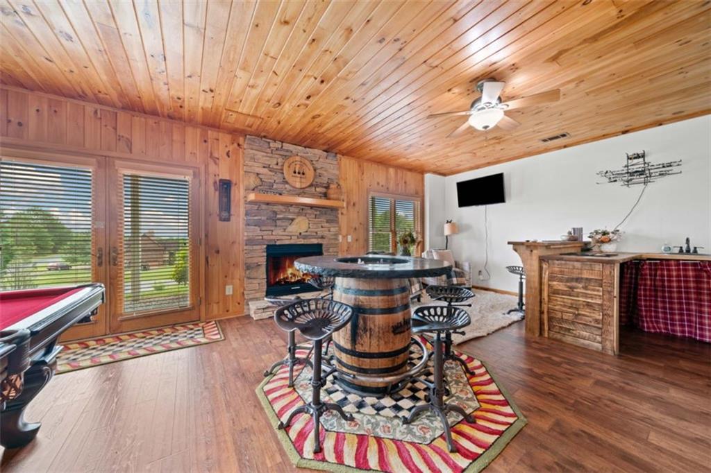 82 Emelia Road Morganton, GA 30560 - Photo 30 of 45 a living room with furniture a large window and wooden floor