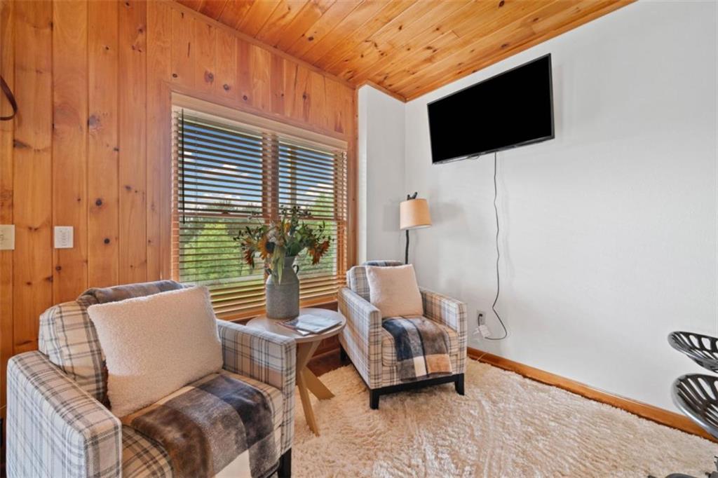 82 Emelia Road Morganton, GA 30560 - Photo 34 of 45 a living room with furniture and a flat screen tv