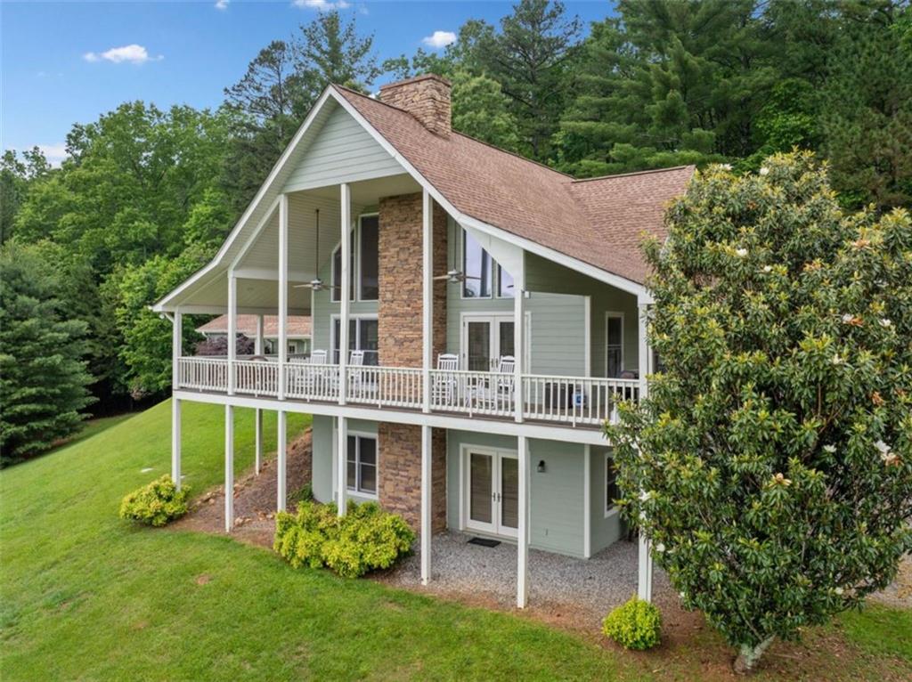 82 Emelia Road Morganton, GA 30560 - Photo 4 of 45 a view of a house with a yard and plants