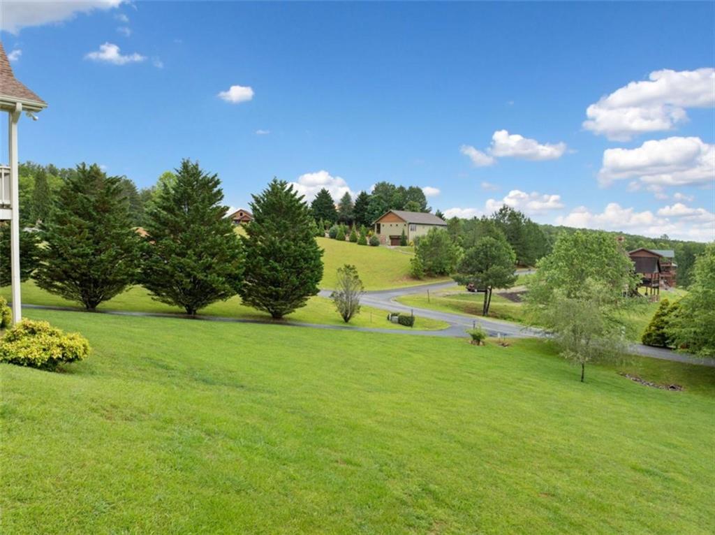 82 Emelia Road Morganton, GA 30560 - Photo 42 of 45 a view of a green field with wooden fence