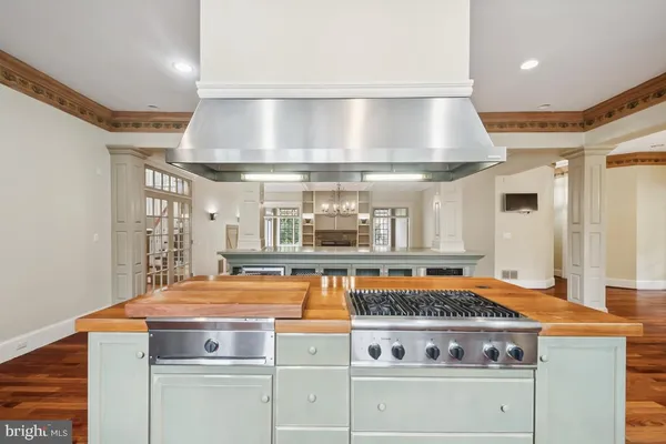 a kitchen with stainless steel appliances granite countertop a stove and a sink