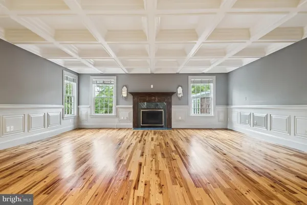 a view of a door with a potted plant on a bench