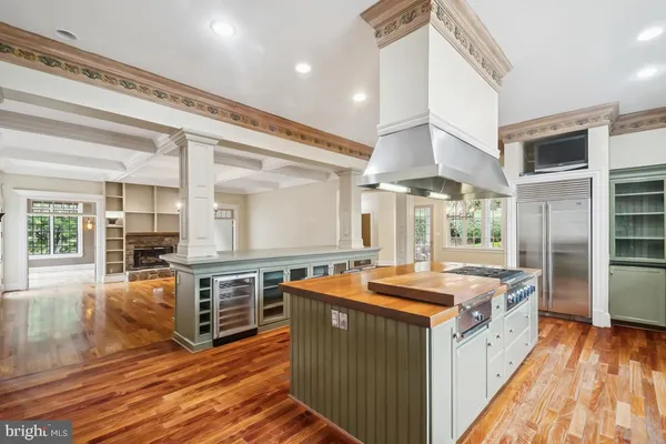 a view of a room with wooden floor and large windows