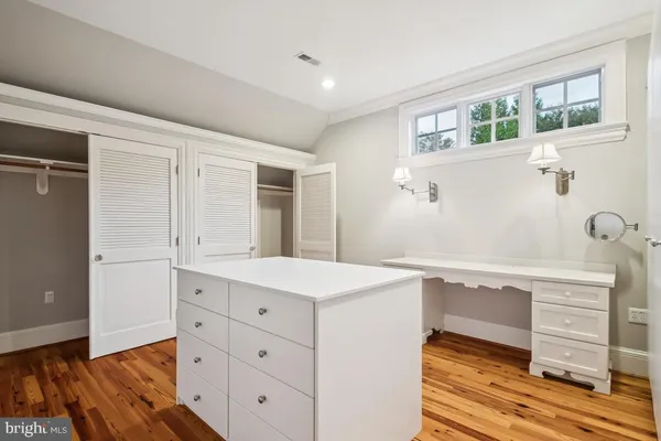 a front view of a house with a yard and porch