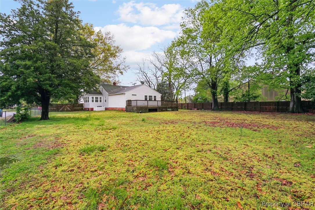 345 Fox Hill Road Hampton, VA 23669 - Photo 41 of 46 View of yard featuring a fenced backyard and a wooden deck