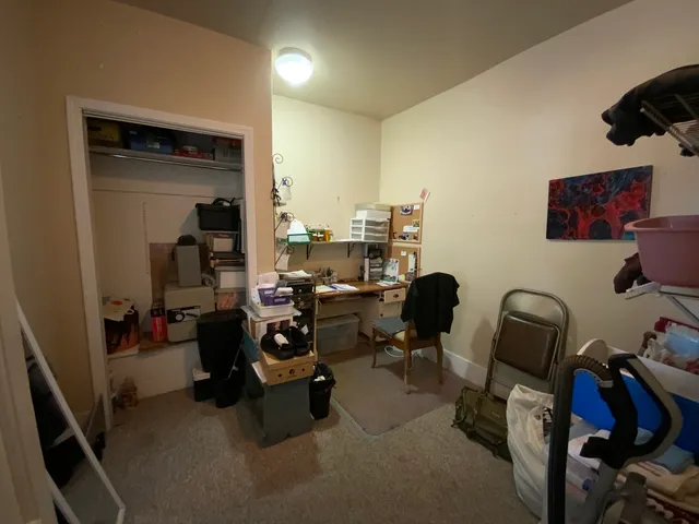 a living room with furniture and a mirror
