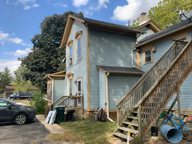 a front view of a house with parking space