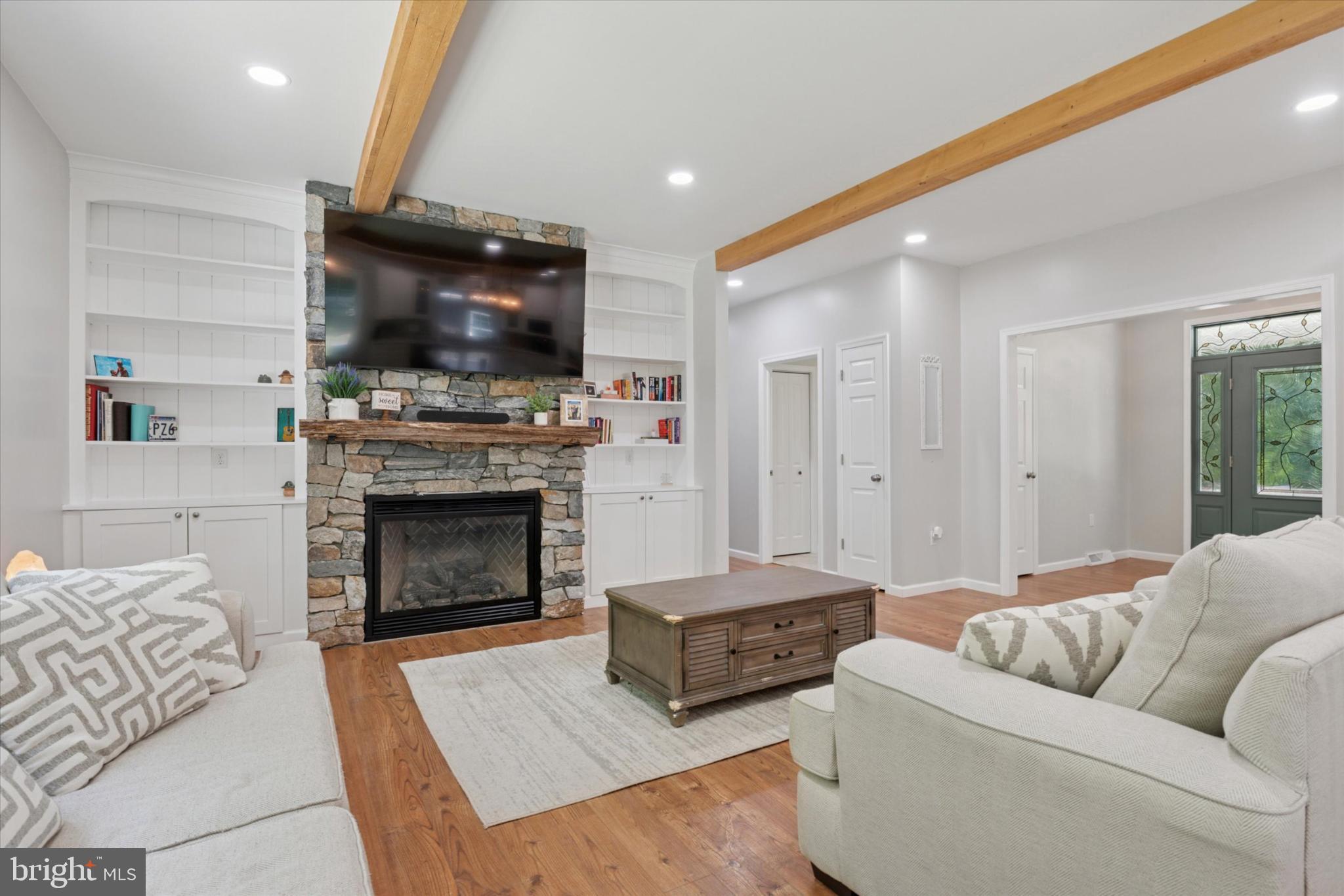 951 North Bailey Road Downingtown, PA 19335 - Photo 6 of 35 Inviting living space with stone fireplace charm.