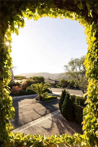 an aerial view of a house with outdoor space