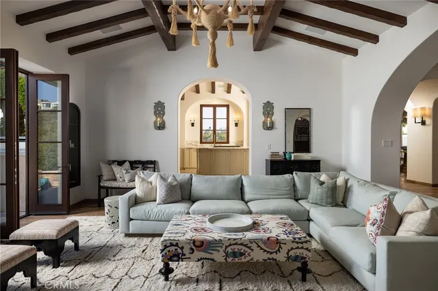 a living room with furniture fireplace and flat screen tv