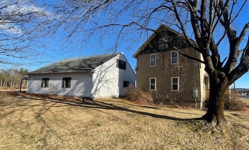 604 Bridge Road Northampton, MA 01060 - Photo 2 of 9 a front view of a house with trees