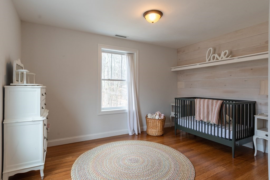 188 South Road Pepperell, MA 01463 - Photo 18 of 41 a bedroom with a bed and a window