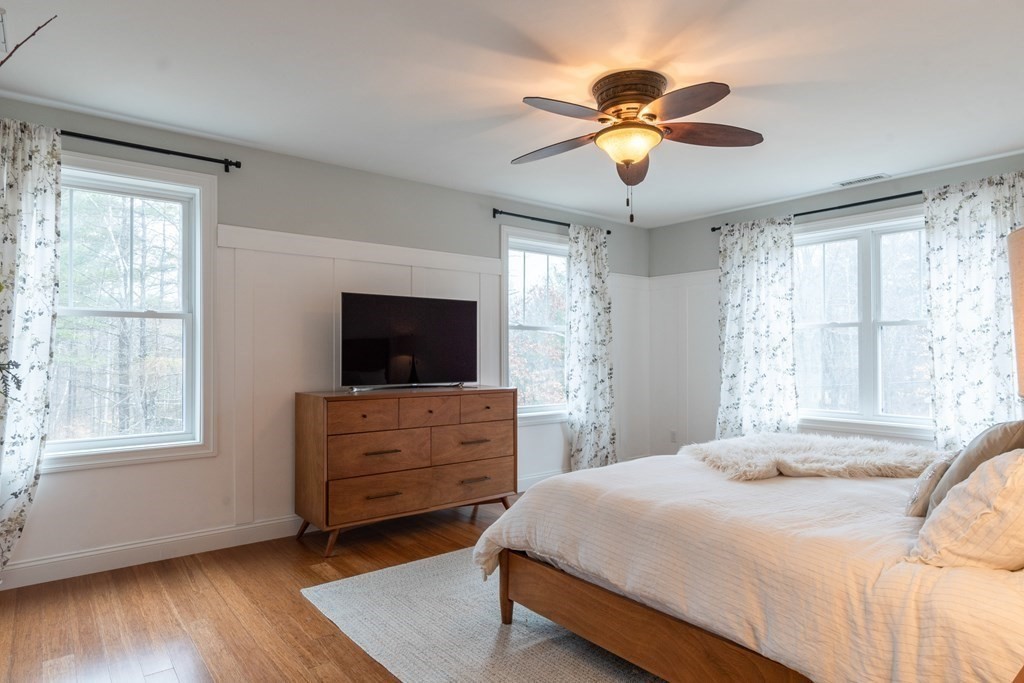 188 South Road Pepperell, MA 01463 - Photo 23 of 41 a bedroom with a bed and a flat screen tv