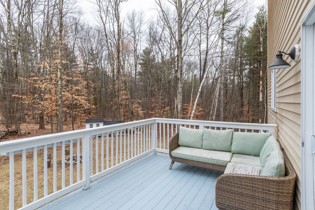 188 South Road Pepperell, MA 01463 - Photo 35 of 41 a balcony with furniture and wooden floor