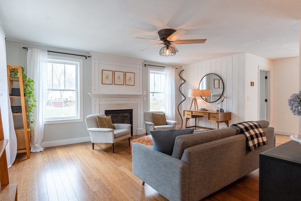 188 South Road Pepperell, MA 01463 - Photo 4 of 41 a living room with furniture and a fireplace
