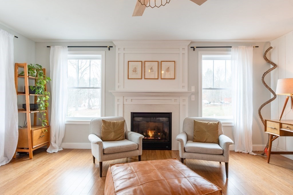 188 South Road Pepperell, MA 01463 - Photo 6 of 41 a living room with furniture and a fireplace