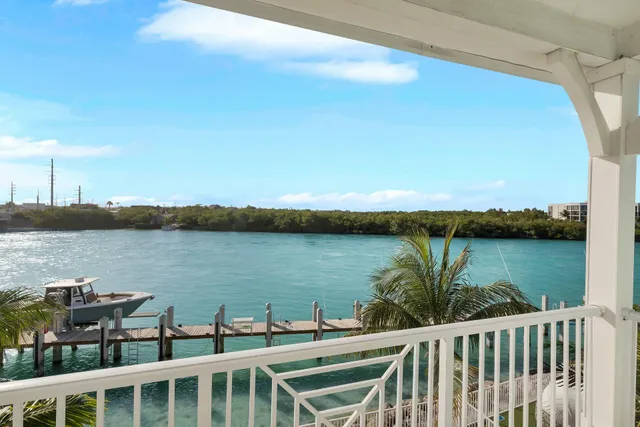 a bedroom with a bed and a television