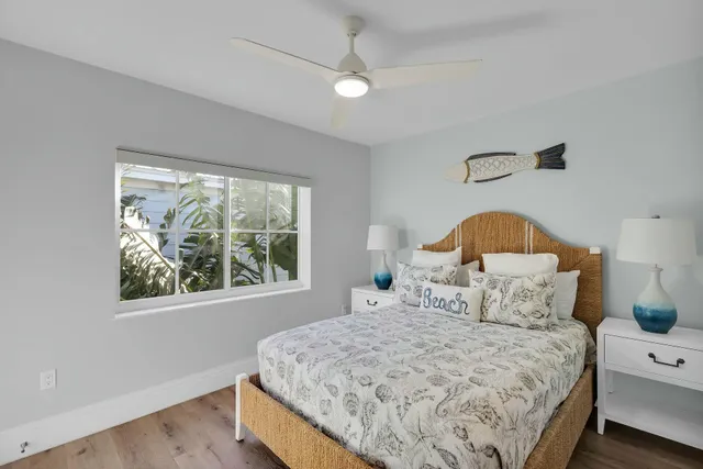 a bedroom with a bed and a lamp on table