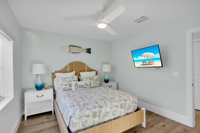 a bedroom with a bed and a view of kitchen