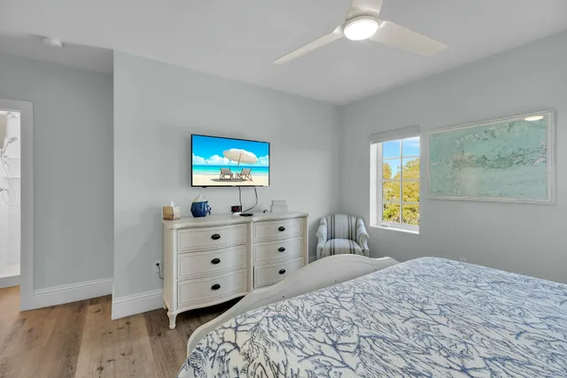 a bathroom with a shower sink and mirror