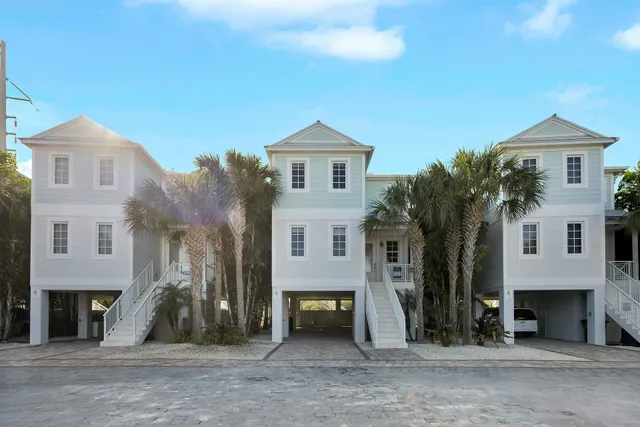 a picture of a wall with windows and white walls