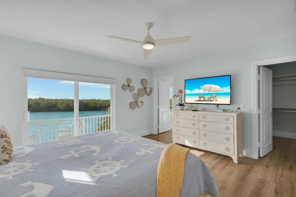 a bedroom with a bed and a lamp on table
