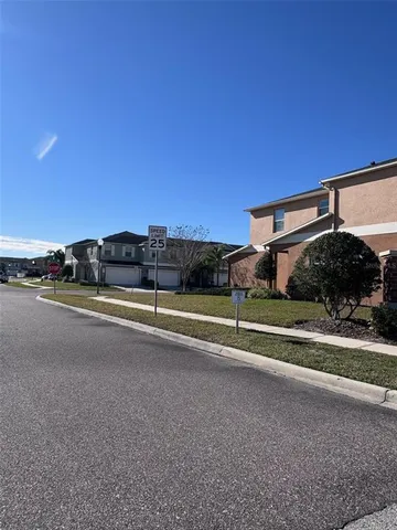 a view of building with car parked